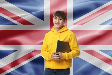 Image of Student with laptop against flag of United Kingdom. Language school