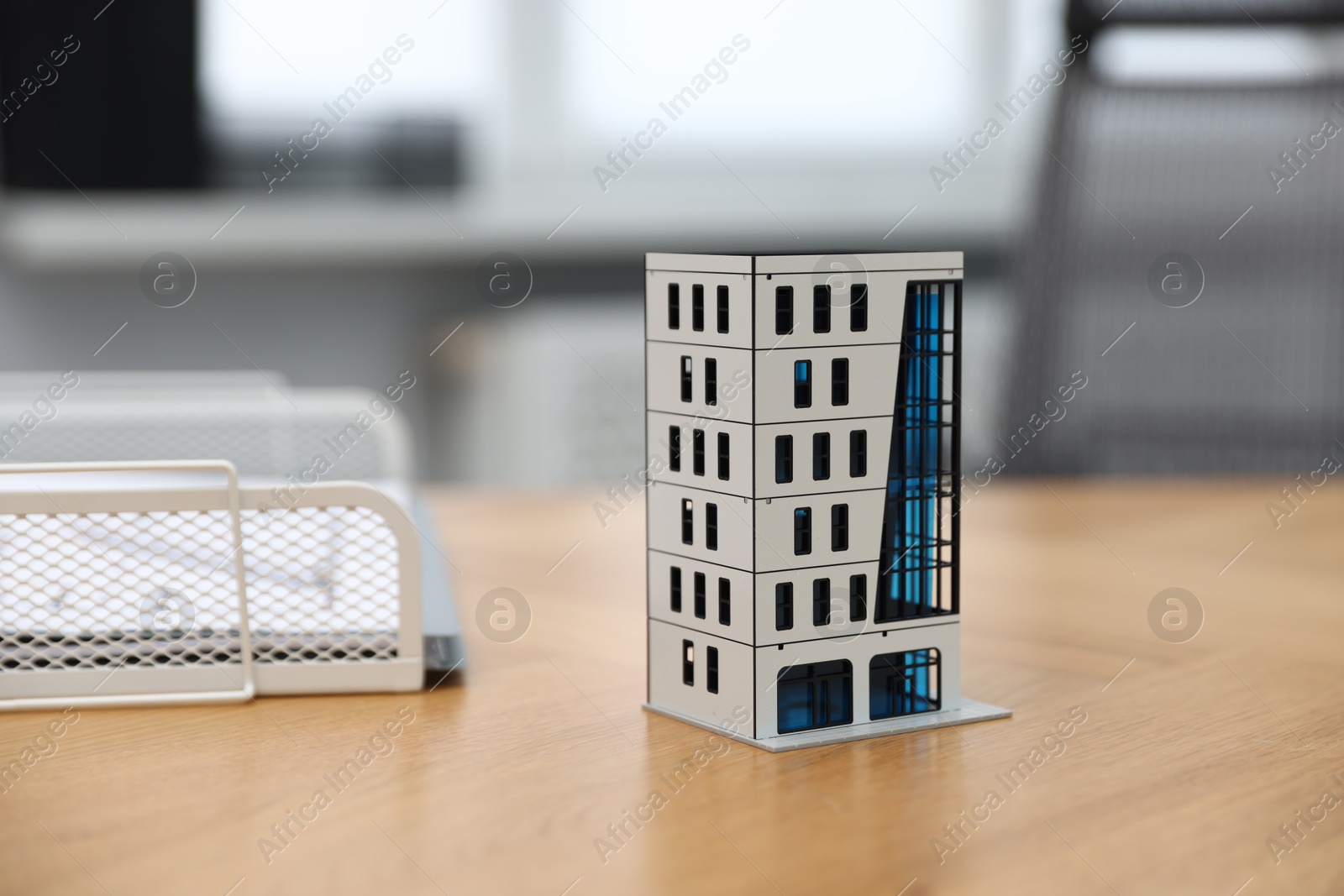 Real estate. Apartment building model on wooden table indoors, closeup Photo of Real estate. Apartment building model on wooden table indoors, closeup