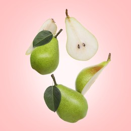 Image of Fresh green pears flying in air on pink background