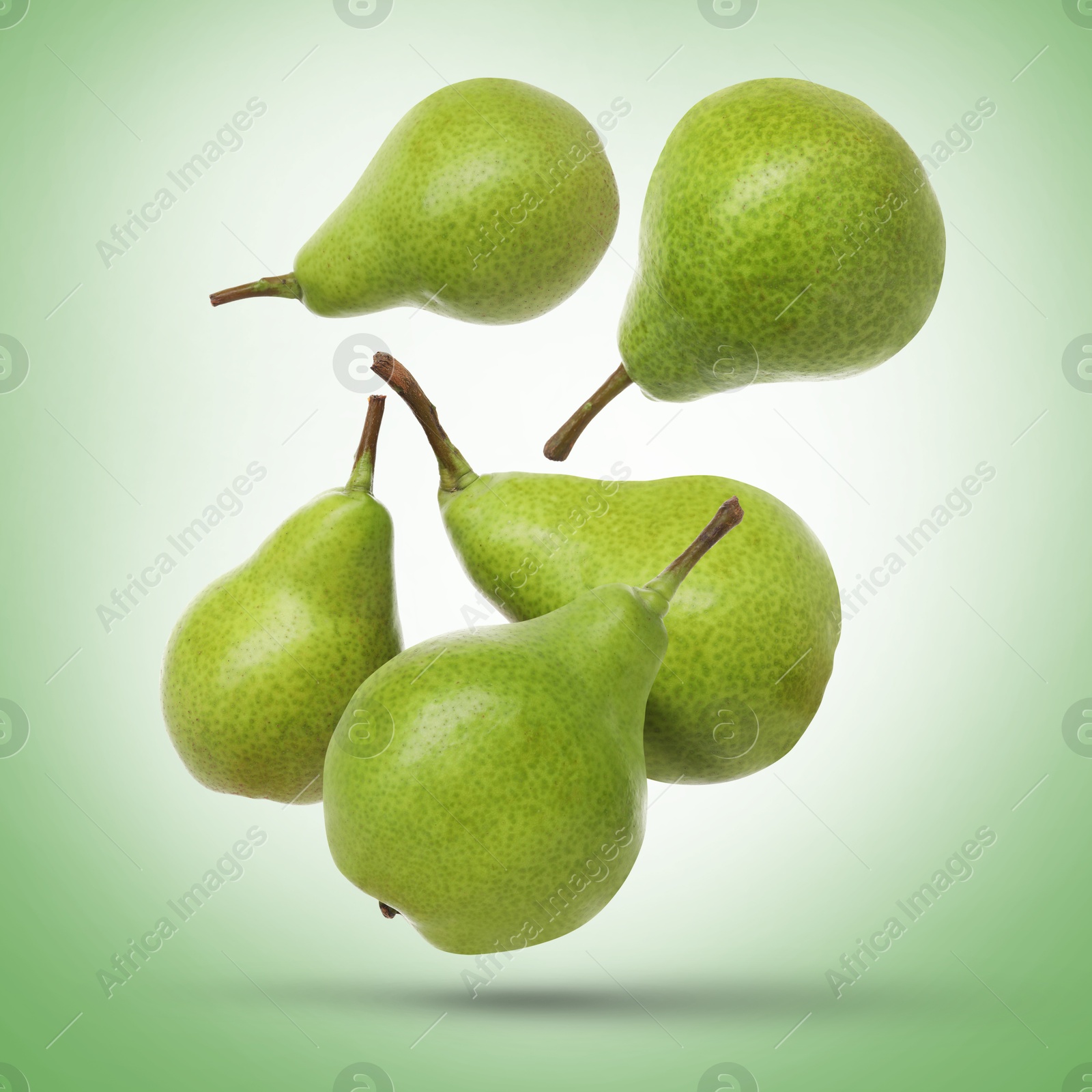 Image of Fresh green pears flying in air on color background