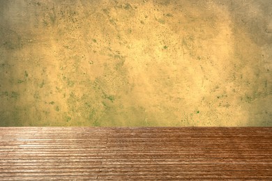 Image of Empty wooden floor and beige grey textured wall. Space for design