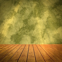 Image of Empty wooden floor and color textured wall. Space for design