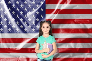Image of Little girl with notebooks against flag of USA. Language school