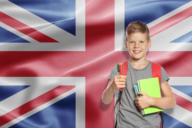 Image of Little boy with backpack and stationery against flag of United Kingrom. Language school