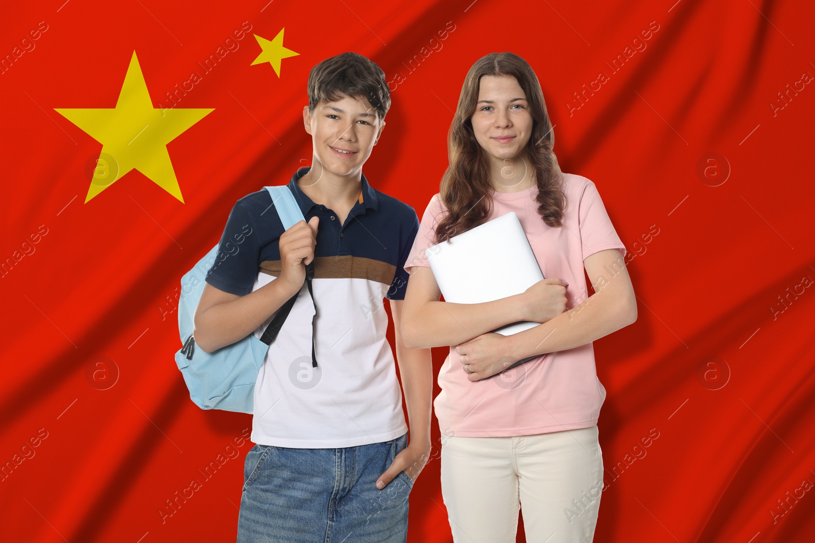 Students against flag of China. Language school Image of Students against flag of China. Language school