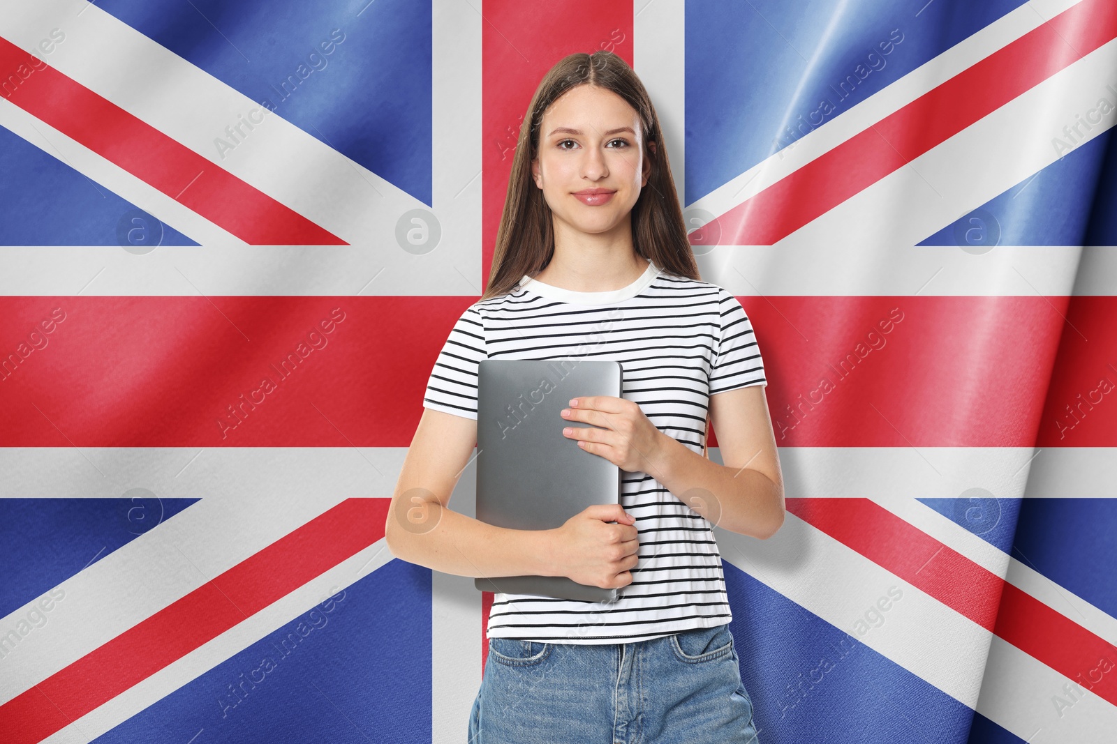 Image of Student with laptop against flag of United Kingdom. Language school