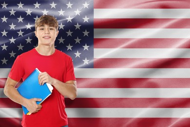 Image of Student with notebooks against flag of USA. Language school