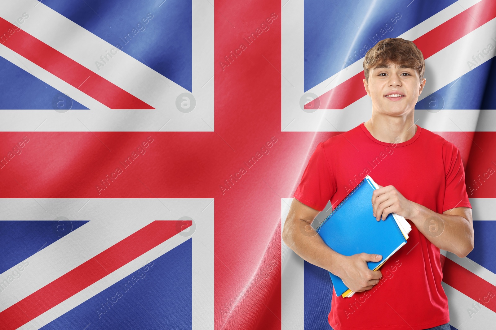 Image of Student with notebooks against flag of United Kingdom. Language school