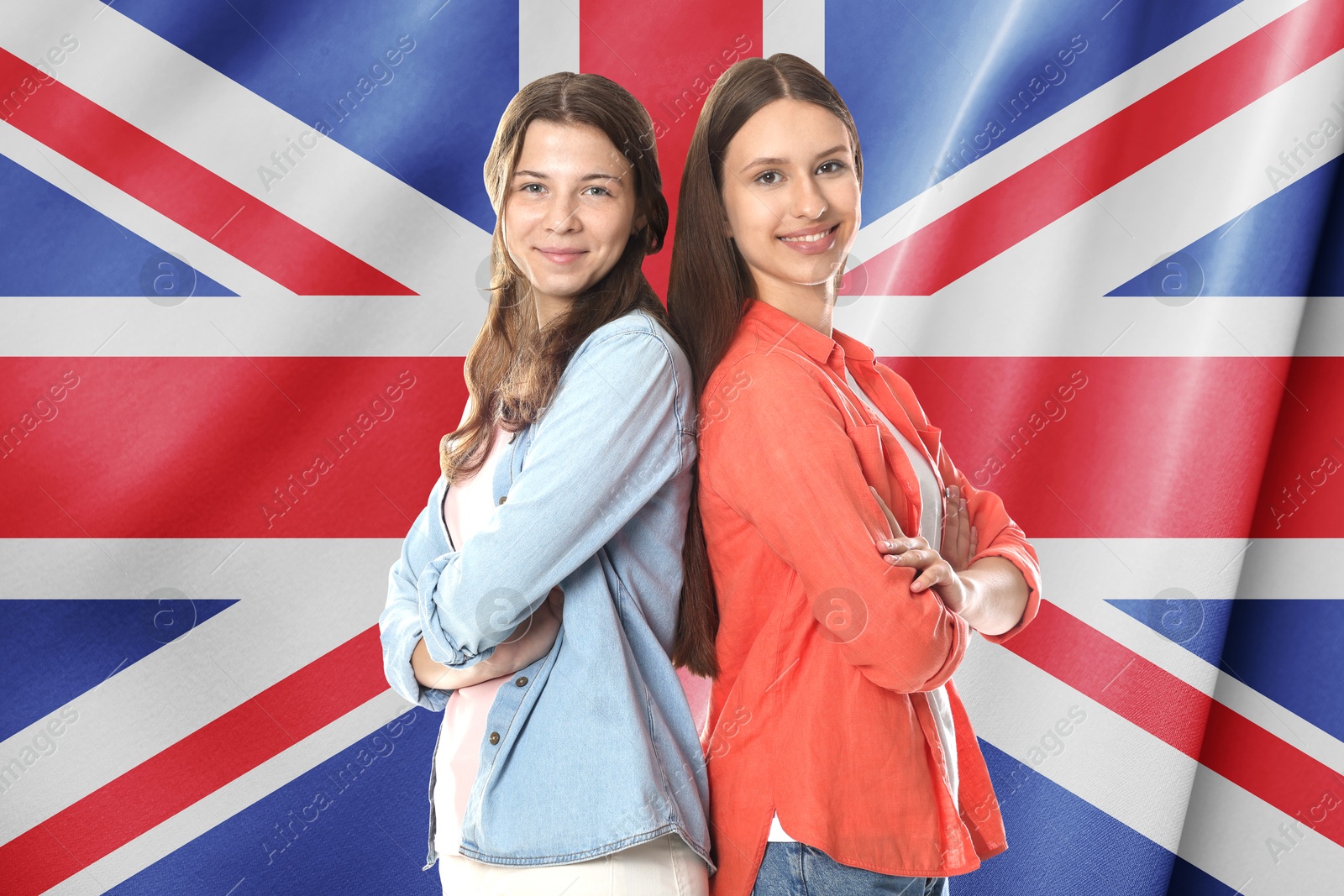 Image of Happy students against flag of United Kingdom. Language school
