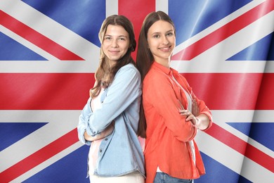 Image of Happy students against flag of United Kingdom. Language school