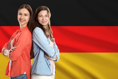 Image of Happy students against flag of Germany. Language school