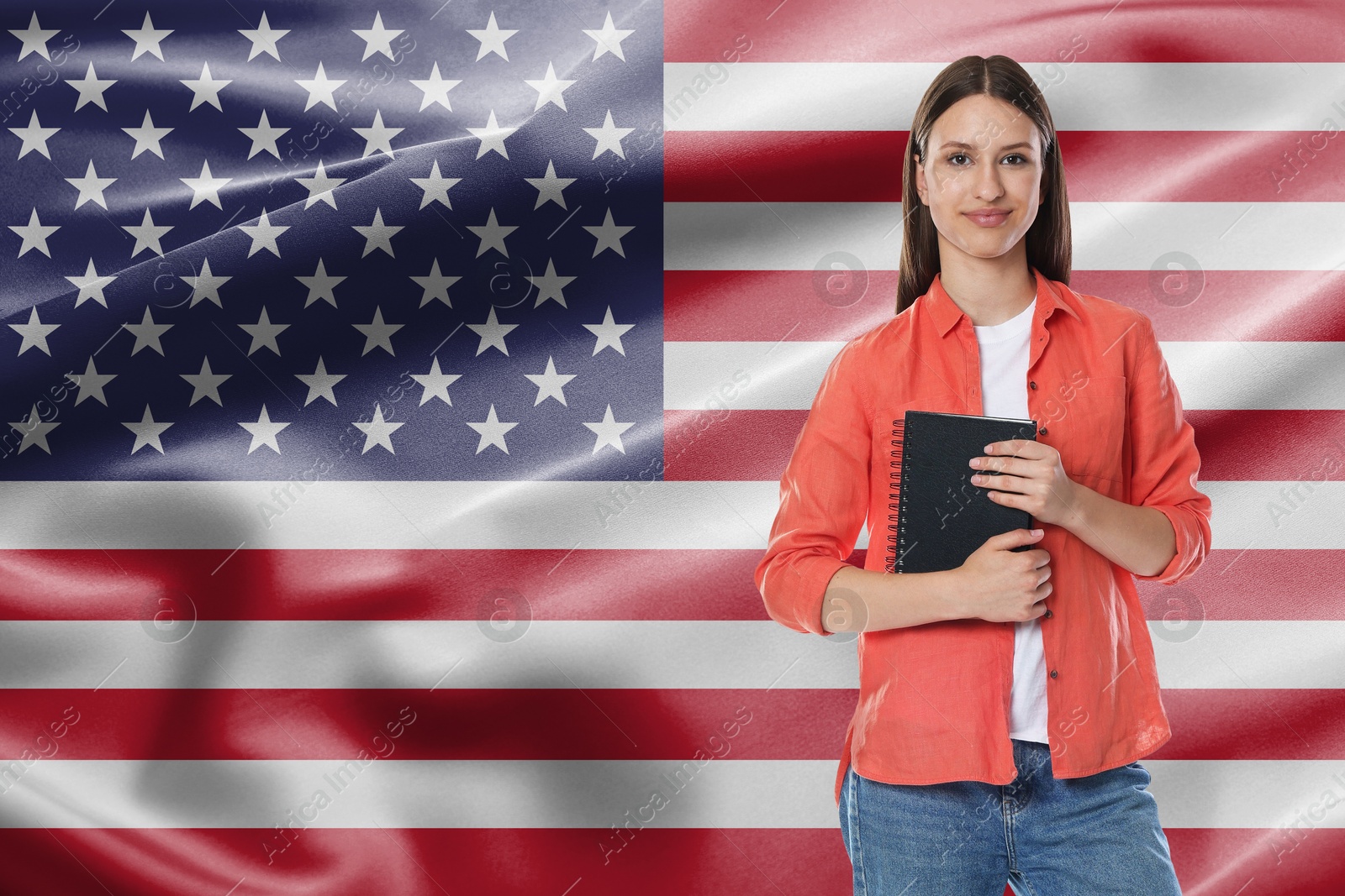 Image of Student with notebook against flag of USA. Language school