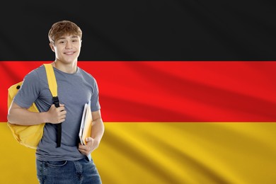 Image of Student with notebooks and backpack against flag of Germany. Language school