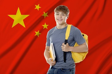 Image of Student with notebooks and backpack against flag of China. Language school
