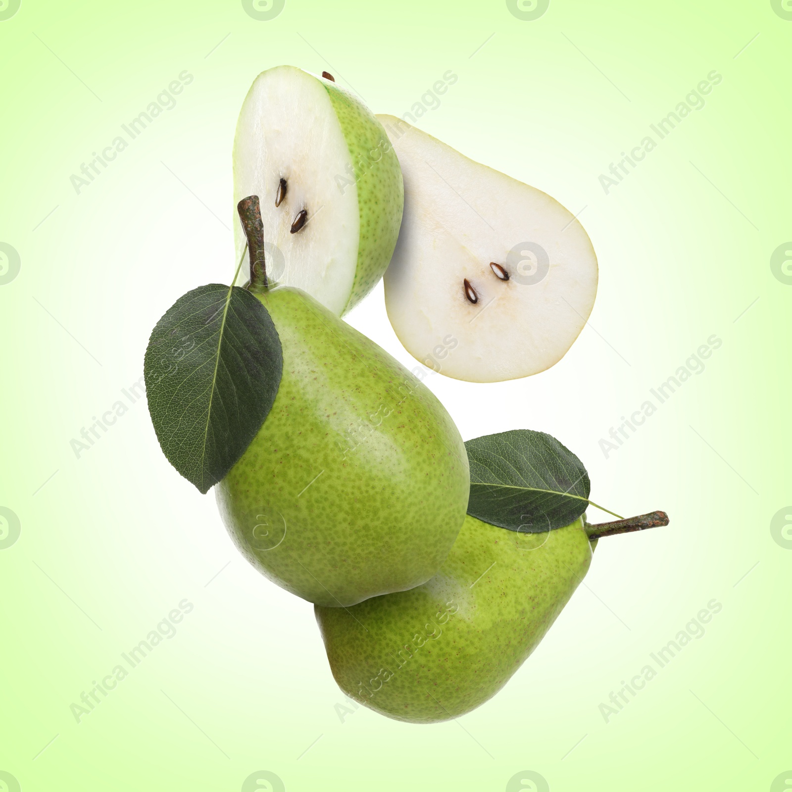 Image of Fresh green pears flying in air on color background