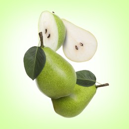 Image of Fresh green pears flying in air on color background
