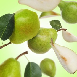 Image of Fresh green pears flying in air on color background