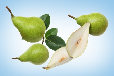 Image of Fresh green pears flying in air on light blue background