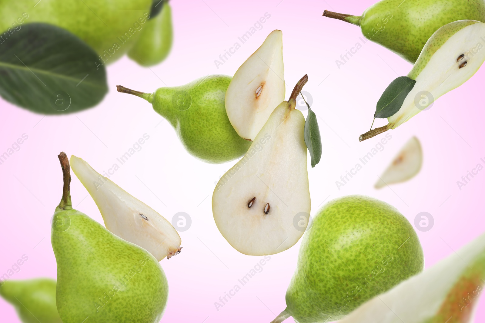 Image of Fresh green pears flying in air on light violet background