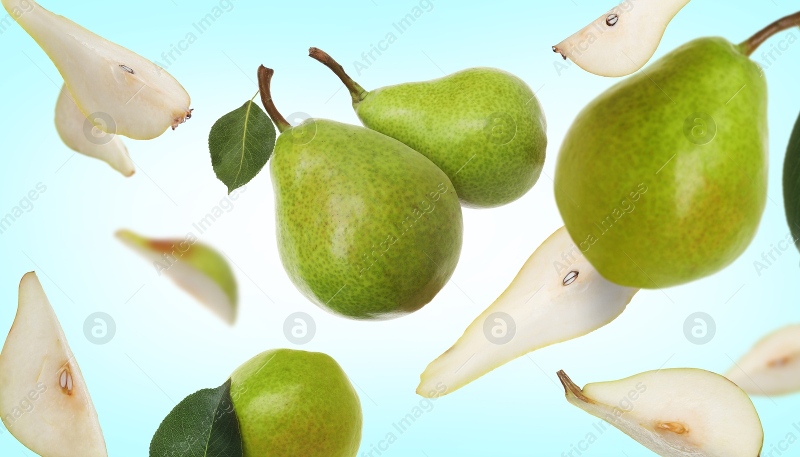 Image of Fresh green pears flying in air on light blue background