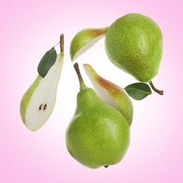 Image of Fresh green pears flying in air on light violet background