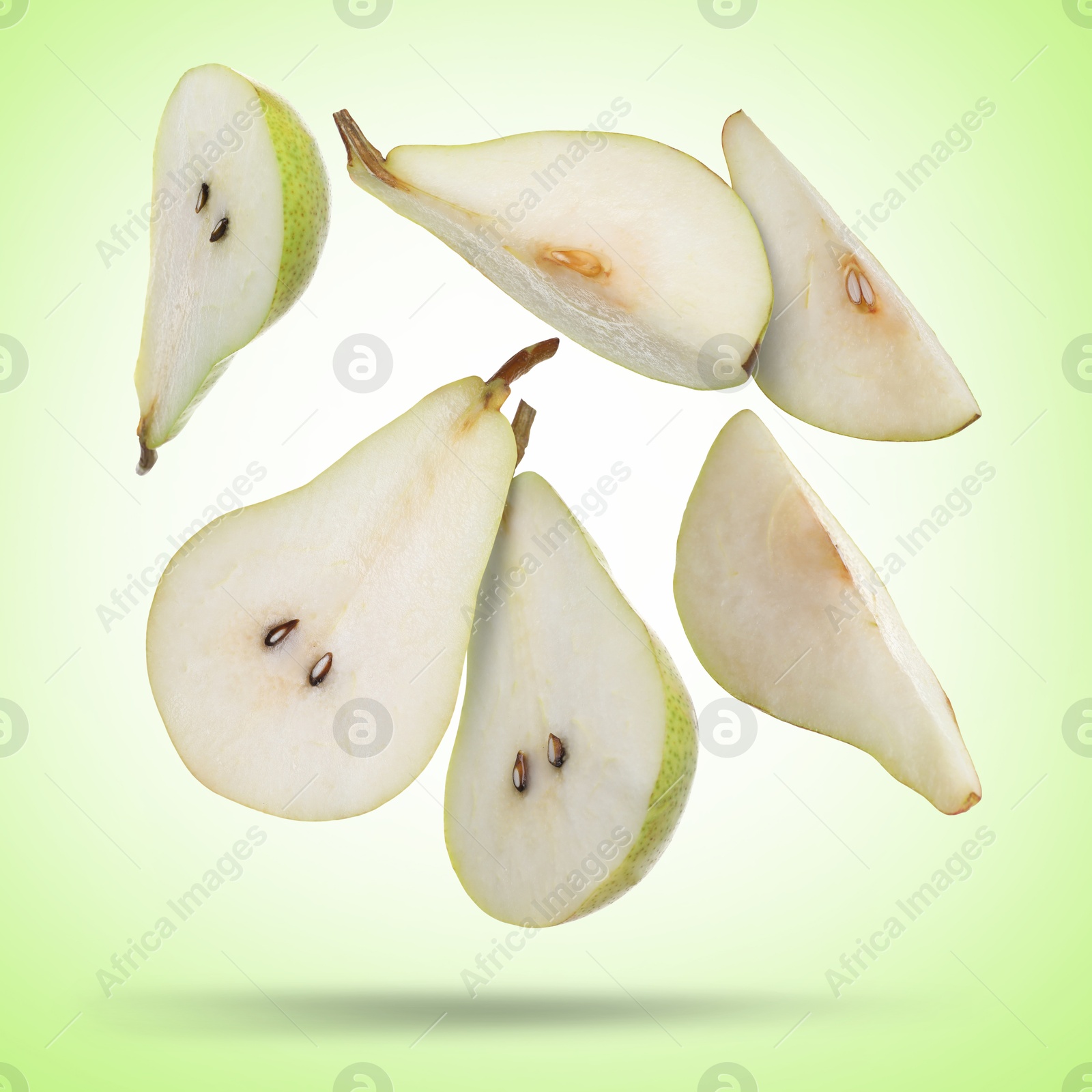 Image of Slices of green pears flying in air on color background