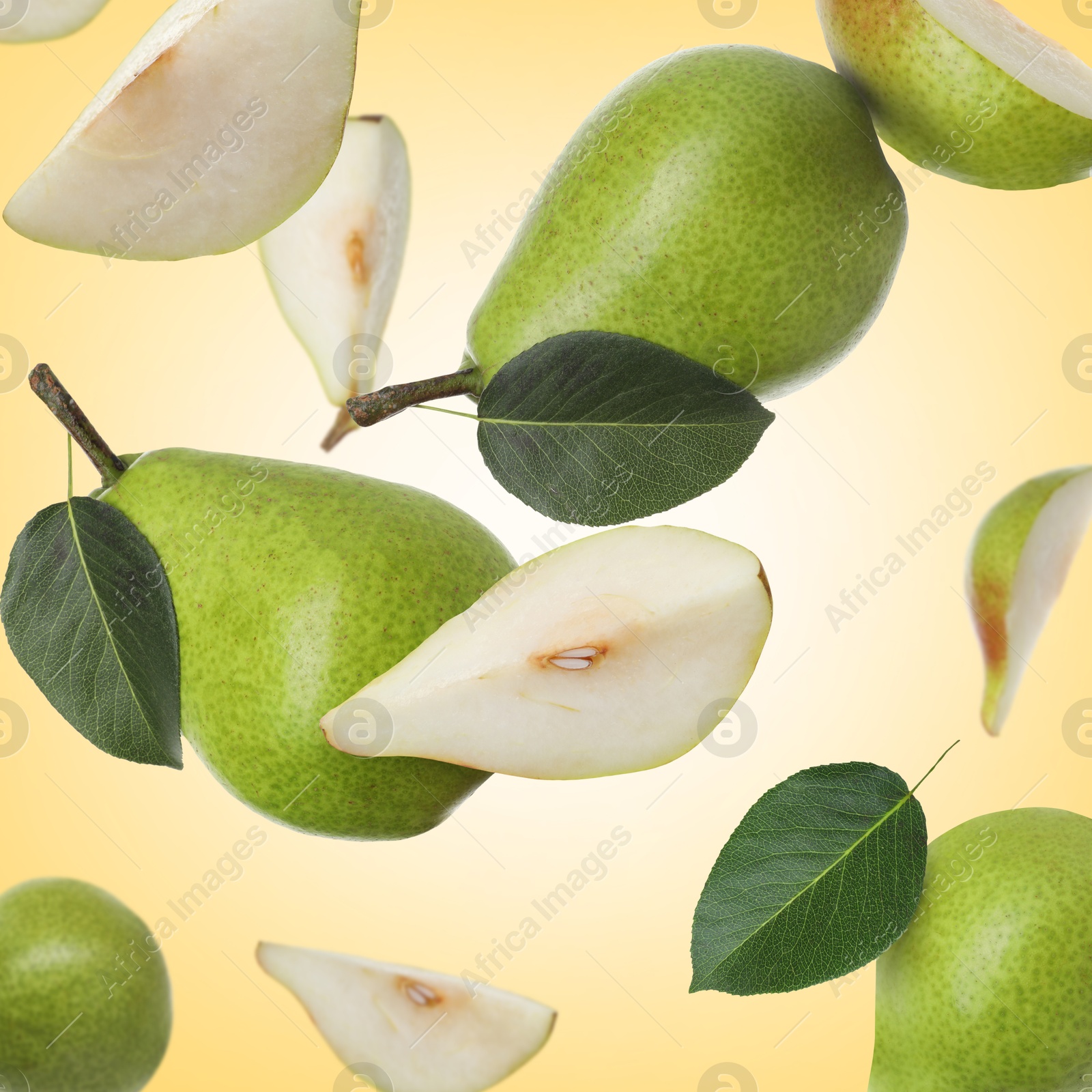 Image of Fresh green pears flying in air on pale orange background