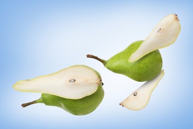 Image of Fresh green pears flying in air on blue background