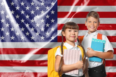 Image of Children with backpacks and notebooks against flag of USA. Language school