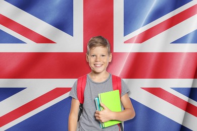 Image of Little boy with backpack against flag of United Kingdom. Language school