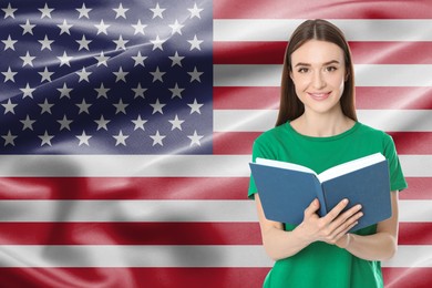 Image of Student or teacher with book against flag of USA. Language school