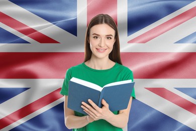 Image of Student or teacher with book against flag of United Kingdom. Language school