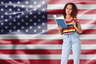 Image of Student with book against flag of USA. Language school