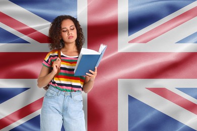 Image of Student with book against flag of United Kingdom. Language school
