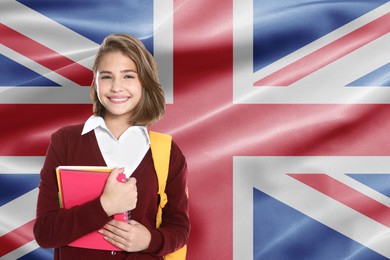 Image of Student with backpack and notebooks against flag of United Kingdom. Language school