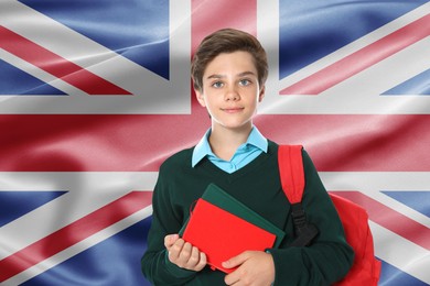 Image of Student with backpack and notebooks against flag of United Kingdom. Language school