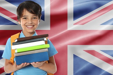 Image of Little boy with books against flag of United Kingdom. Language school
