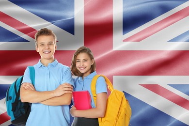 Image of Students with backpacks against flag of United Kingdom. Language school