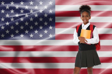 Image of Little girl with backpack and notebooks against flag of USA. Language school