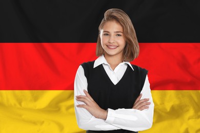Image of Happy student against flag of Germany. Language school