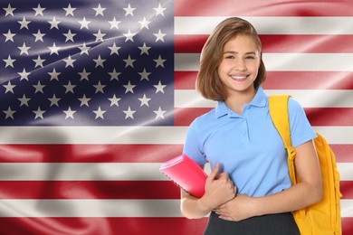 Image of Happy student with backpack and notebook against flag of USA. Language school