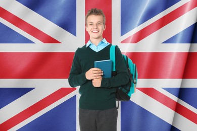Image of Happy student with backpack and book against flag of United Kingdom. Language school