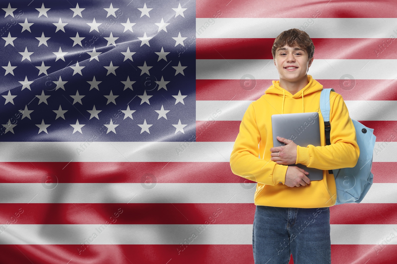Image of Student with laptop and backpack against flag of USA. Language school