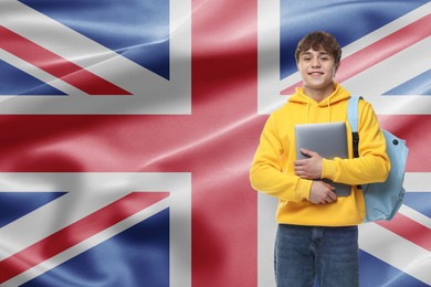 Image of Student with laptop and backpack against flag of United Kingdom. Language school