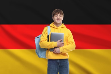 Image of Student with laptop and backpack against flag of Germany. Language school