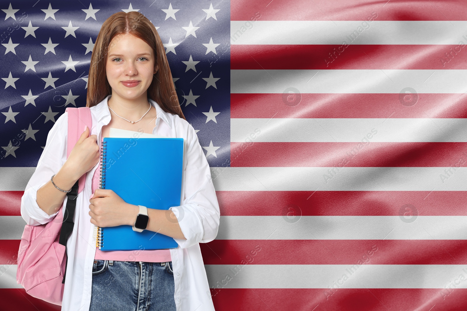 Image of Student with notebook and backpack against flag of USA. Language school