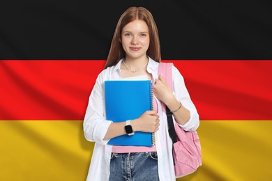 Image of Student with notebook and backpack against flag of Germany. Language school