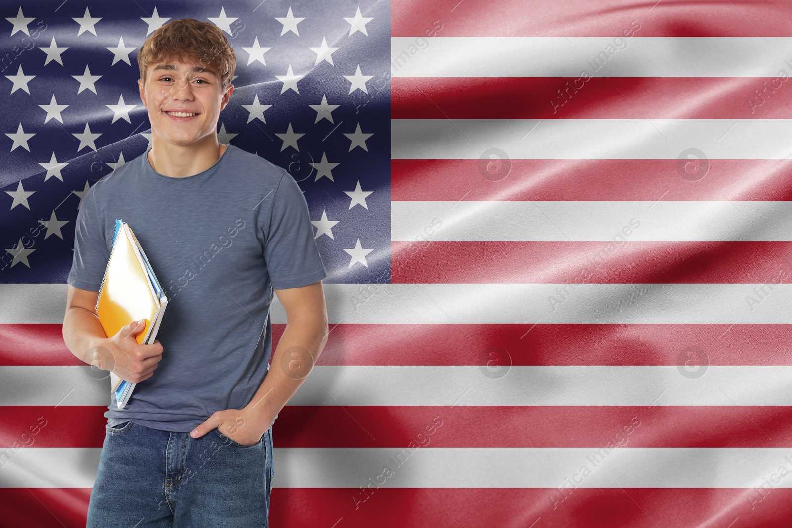 Image of Happy student with notebooks against flag of USA. Language school