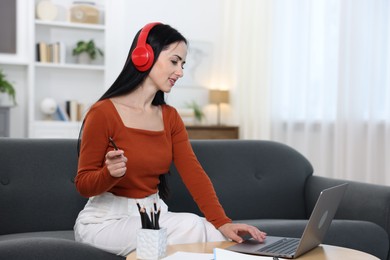 Photo of Woman passing online test on laptop at home