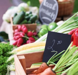 Photo of Many different vegetables on stall at farmer's market, closeup